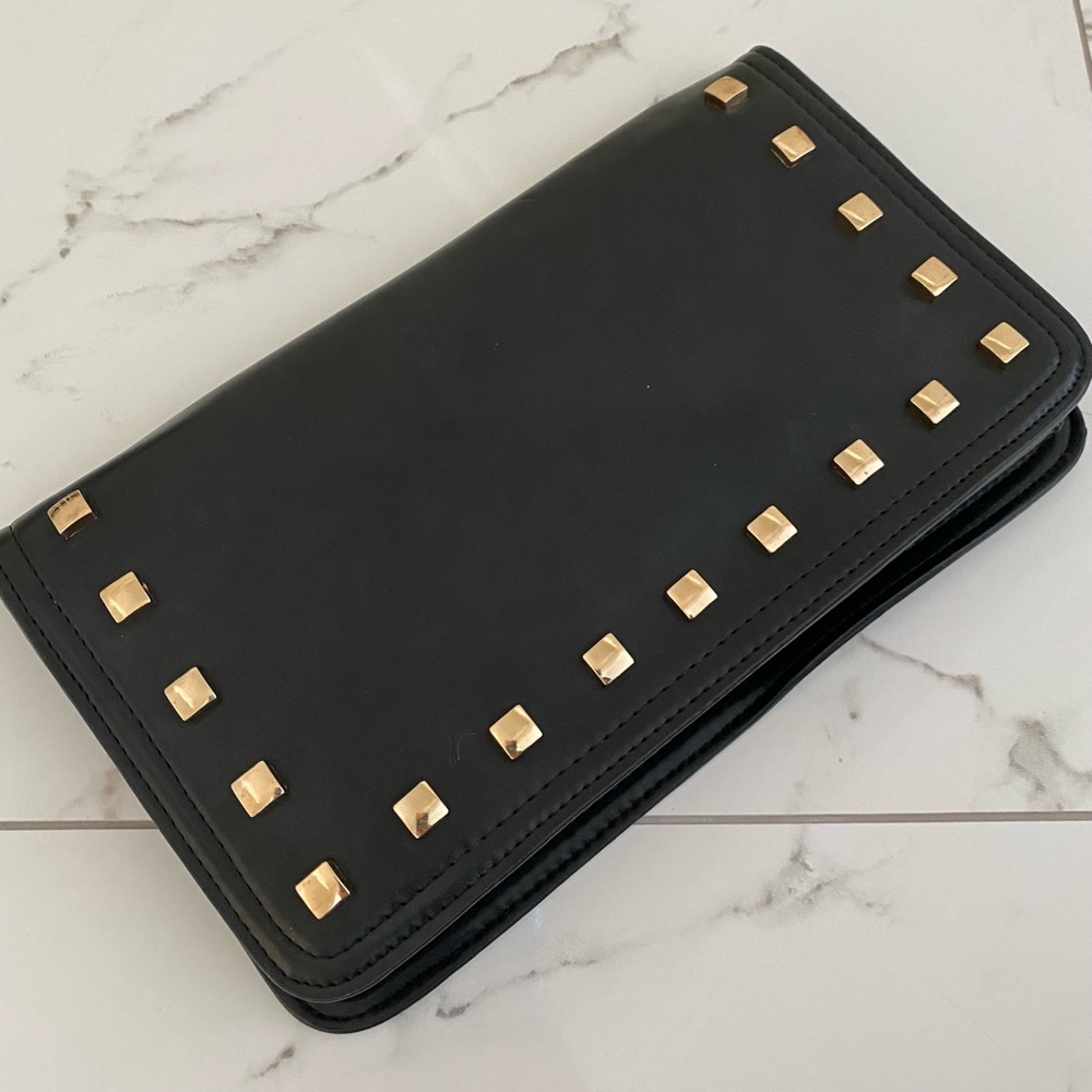 Large black clutch with gold studs